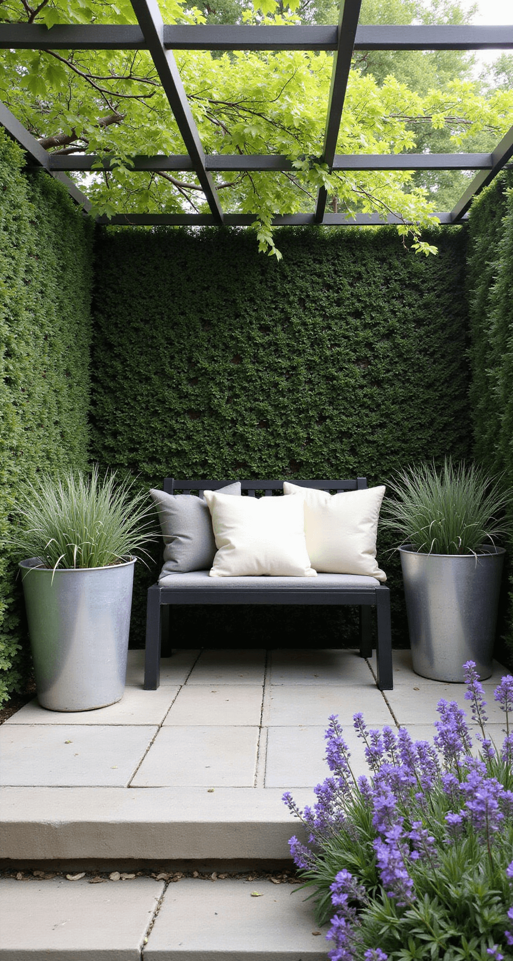 Creating a Modern Cottage Garden: Your Ultimate Design Guide A cozy 8x8ft garden corner with a minimalist black metal bench surrounded by structured box hedging, dappled morning light filtering through a pergola, oversized zinc planters with architectural grasses, and informal drifts of purple salvias, featuring natural stone paving in warm grey tones and simple cream linen cushions.