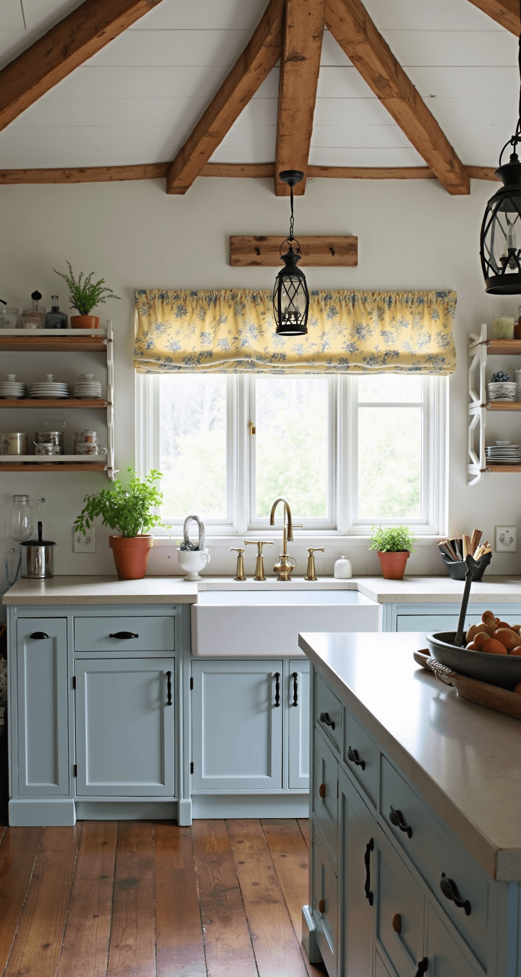 Light Blue Kitchen Cabinets: A Stunning Transformation Guide A cozy farmhouse-style kitchen featuring pale gray-blue cabinets, rustic wooden beams along the ceiling, and natural light filtering through cafe curtains. The soapstone countertops and white apron sink enhance the authentic feel, complemented by antique brass hardware and lantern pendants. Vintage accessories, an enamelware collection, and fresh herbs in terra cotta pots add lived-in charm, with morning light highlighting the cabinet color variation.