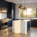 Photorealistic interior of a modern navy kitchen featuring tall shaker cabinets, white Carrara marble island, and light oak herringbone floors, illuminated by warm sunlight through large windows.