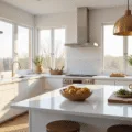 Hyperrealistic image of a modern sunlit kitchen featuring white shaker cabinets, a quartz island, natural light, and warm styling elements.