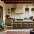 Cinematic wide-angle shot of a boho outdoor kitchen at sunset, featuring whitewashed brick walls with brass lanterns, a vintage peacock rattan chair, an antique copper sink, and Kilim cushions on industrial stools, all illuminated by Edison string lights.