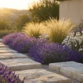 Hyperrealistic photograph of a luxurious stone garden at sunset, showcasing weathered limestone blocks, cascading lavender, white alpine flowers, and tall grasses, with dramatic lighting and soft bokeh against a Mediterranean backdrop.