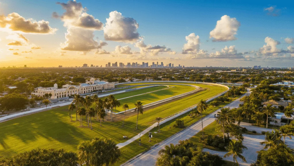 Hialeah in November: Your Ultimate Weather and Travel Guide "Aerial view of Hialeah, Florida featuring Hialeah Park racetrack and Amelia Earhart Park at sunset with Miami skyline in the background"